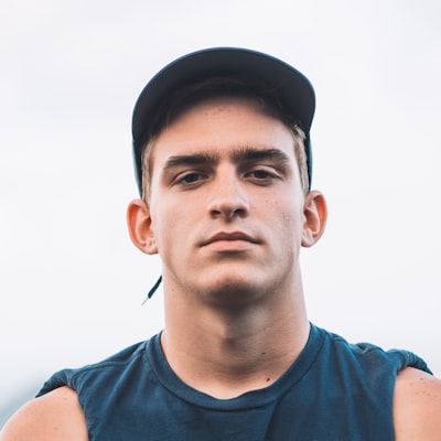 Portrait of a young man wearing a backwards cap